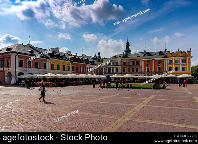 Zamosc, Poland - 13 September, 2021: the Great Market Square in Old Town Zamosc with colorful buildings and restaurants