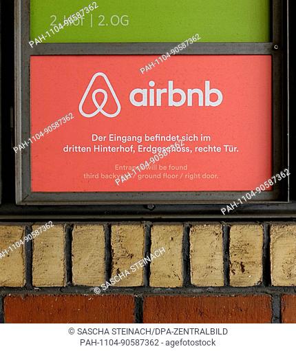 View of a sign with the logo of rental platform airbnb in Brunnenstrasse in the Mitte neighbourhood of Berlin. air bnb is a community marketplace for booking...