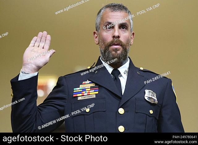 Washington Metropolitan Police Department officer Michael Fanone is sworn in to testify to the House select committee hearing on the Jan