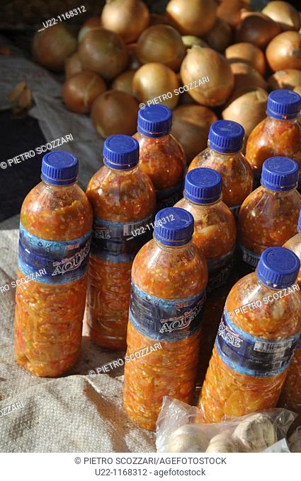 Dili (East Timor): chili sauce in recycled water bottles sold at the Leicidere neighborhood's market