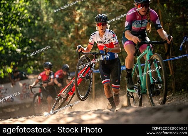 TOI TOI Cup Czech cup in cyclocross, cyclocross, women, Kristyna Zemanova holds her bicycle in sand, left Alicia Franck (BEL), Kolin, on September 28, 2023