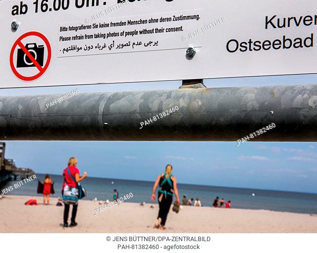 A sign at the beach entrance informs holiday makers on the photo rules in Boltenhagen, Germany, 20 June 2016. On the Baltic sea beach