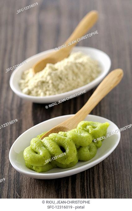Wasabi with wooden spoons in small bowls