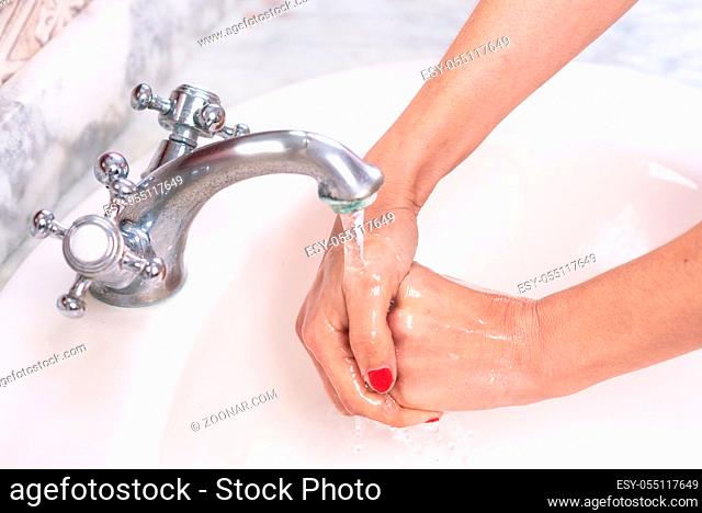 Young woman washing hands, cleaning hands Hygiene