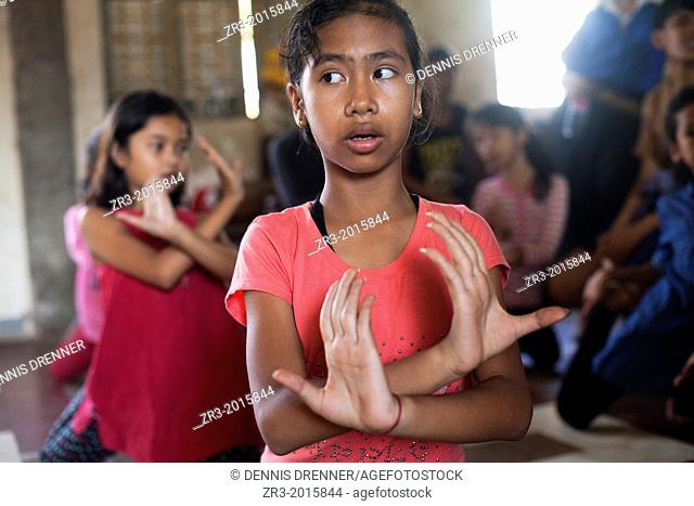 Young dancers practice traditional Cambodian dance which they perform at the National Museum in Phnom Penh, Cambodia