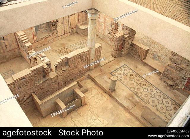 Archaeological remains with decorative tile floors and frescoes paintings in a hillside house on the slopes of the ancient city ruins of Ephesus