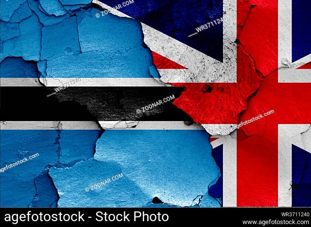 flags of Botswana and UK painted on cracked wall