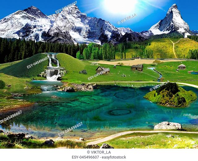 Mountain village settlement. Sunny morning. Waterfalls, ponds and a lake
