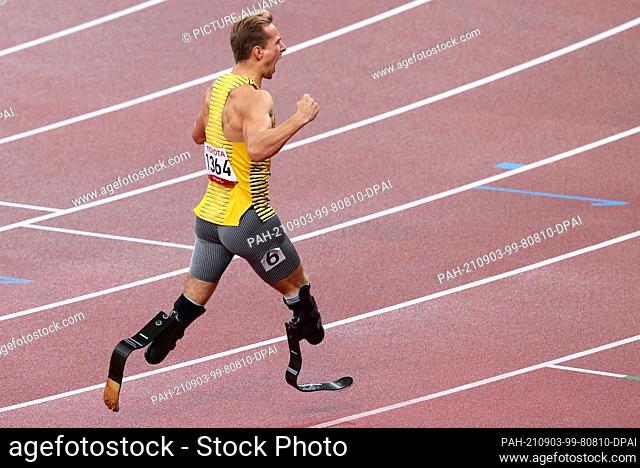 03 September 2021, Japan, Tokio: Paralympics: Athletics, men's 400 metres, T62 final, at the Olympic Stadium. Johannes Floors from Germany is happy about gold