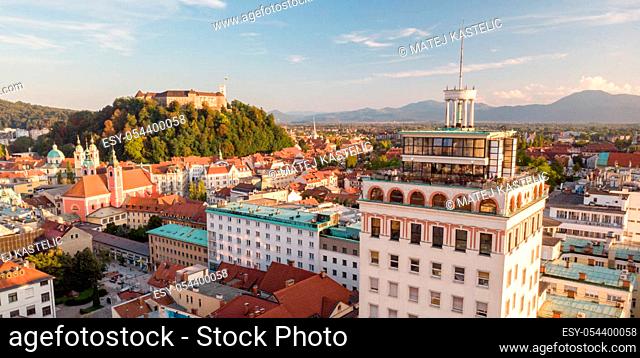 Aerial panoramic view of Ljubljana, capital of Slovenia in warm afternoon sun. Old skyscraper of Ljubljana with it's panoramic rooftop terrace dominating the...