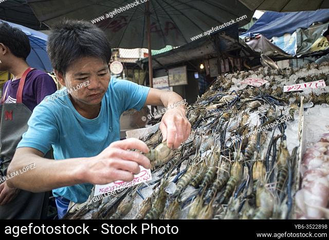 Fish market vendor in Samut Sakhon, Bangkok, Thailand