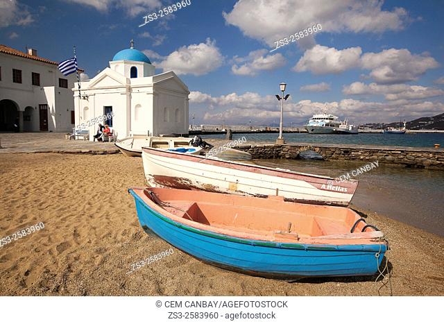 Colorful fishing boats and a blue domed church by the sea, Mykonos, Cyclades Islands, Greek Islands, Greece, Europe