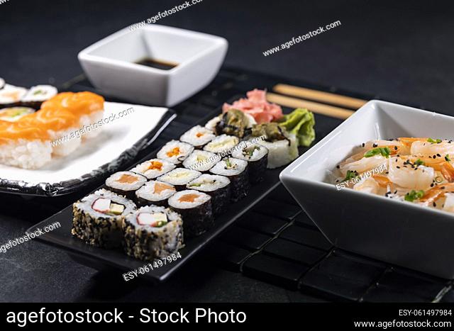 Various dishes of Asian cuisine with typical sushi