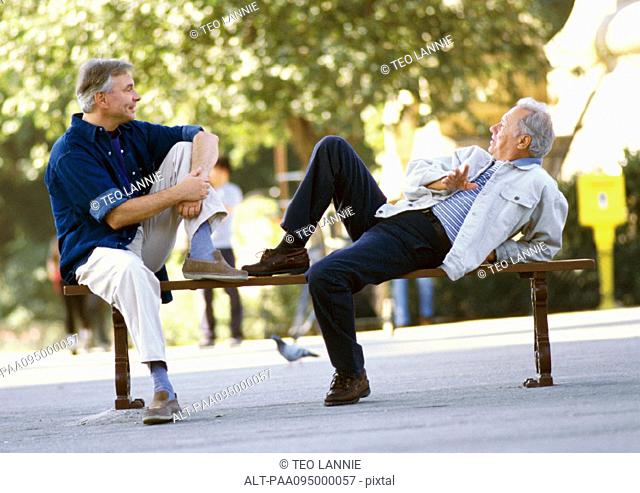 Mature men sitting on a bench