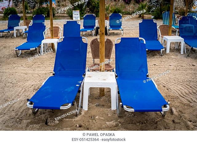 Empty deckchairs before the start of a touristic season on an Alykes beach in Zante, Greece