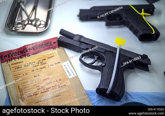 sealed automatic pistol in crime lab, crime investigation, concept image