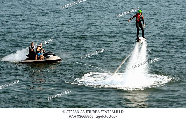 Marc Gamradt from bansin flying with a Flyboard on the Baltic Sea as part of a sports event during sunny weather in Heringsdorf, Germany, 11 September 2016