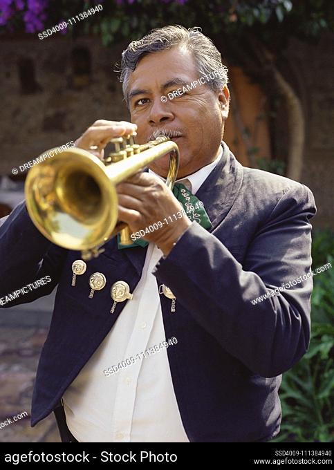 Hispanic man playing trumpet