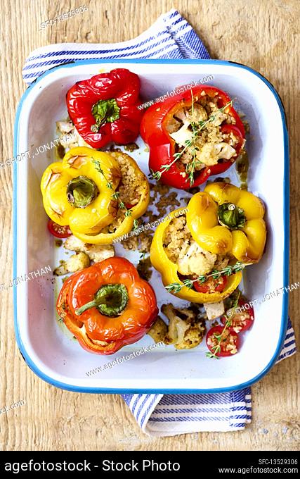 Peppers filled with couscous, cauliflower and cherry tomatoes