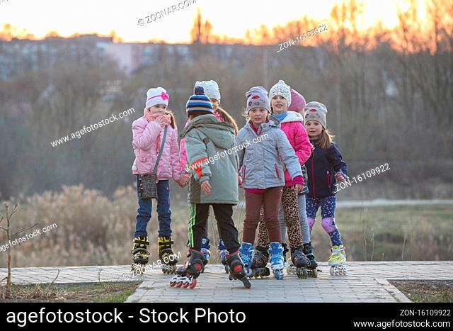 Belarus, Gomel city, April 04, 2019. Neighborhood area.A group of kids in roller skates on the street