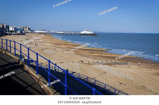 The beach and coastline with the pier in the distance, at Eastbourne, East Sussex, UK