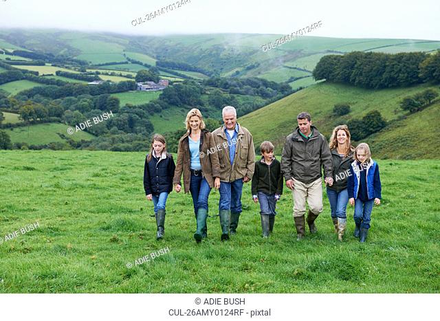 Generational family walking in fields