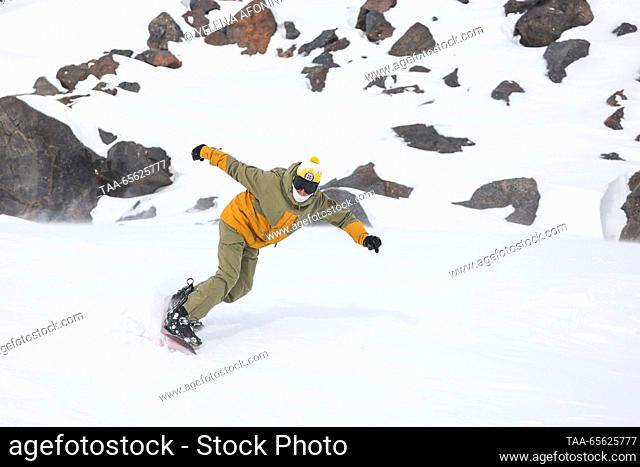 RUSSIA, KABARDINO-BALKAR REPUBLIC - DECEMBER 10, 2023: A holidaymaker enjoys the opening of another winter season at the Elbrus ski resort in the village of...