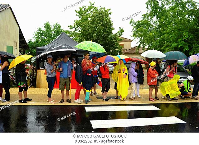 waiting in the rain for the 2014 Tour de France Stage 19 at Monbazillac, Dordogne Department, Aquitaine, France