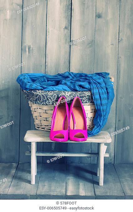 Photo of pink shoes and blue scarf