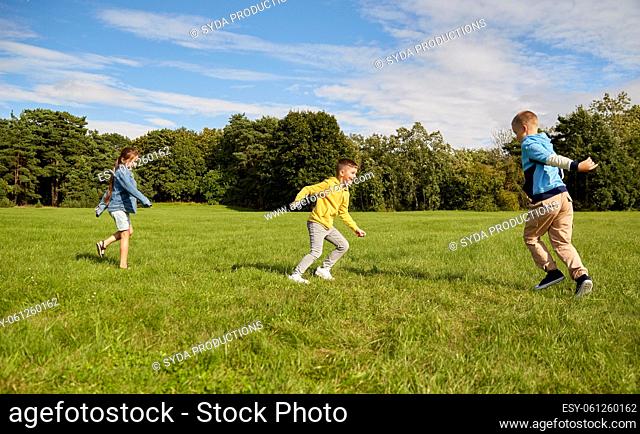 happy children playing and running at park