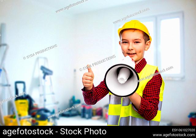 boy in helmet with megaphone showing thumbs up