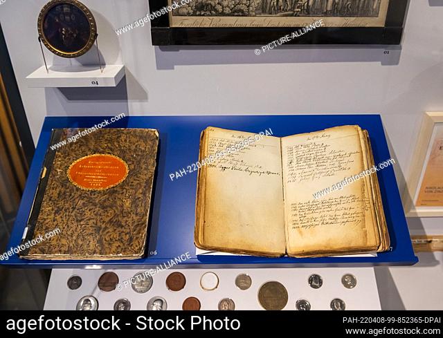 25 March 2022, Saxony, Herrnhut: Historical books in the special exhibition ""Aufbruch. Network. Memory - 300 Years of Herrnhut"" in the Ethnological Museum...