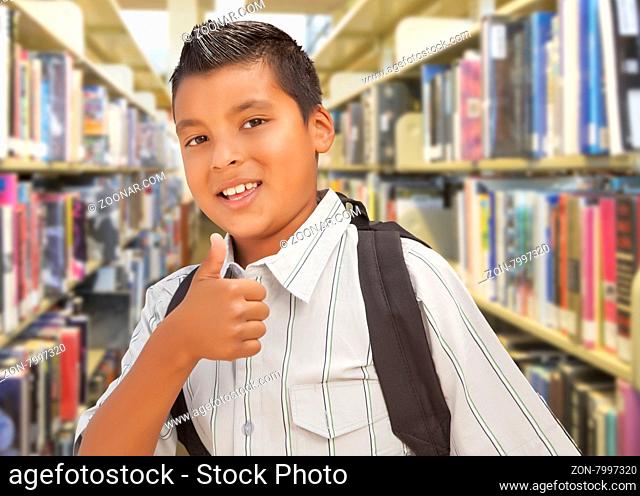 Handsome Hispanic Student Boy with Back Pack and Thumbs Up in the Library