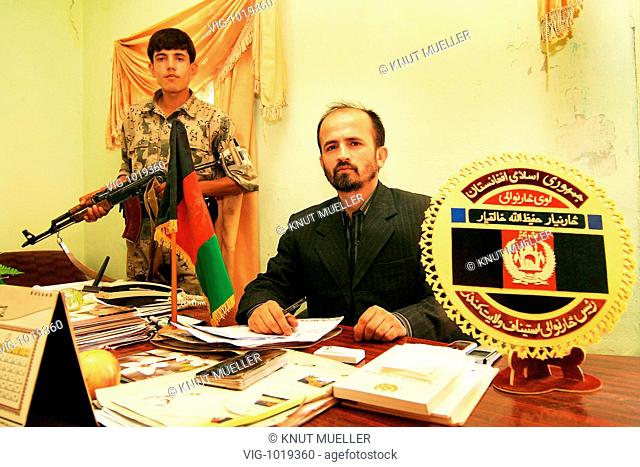AFG, Afghanistan, Kunduz, district attorney of Kunduz-province, Hafizullah Khaliqjar, with bodyguard in his office . - Kunduz, Kunduz, Afghanistan, 22/09/2008