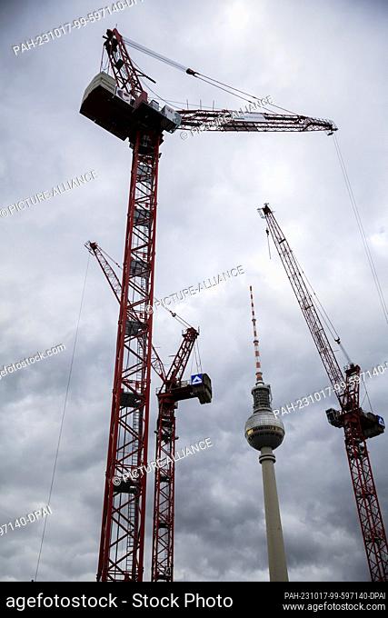 PRODUCTION - 17 October 2023, Berlin: Construction cranes of the Covivio high-rise building site tower up in front of the Berlin TV tower