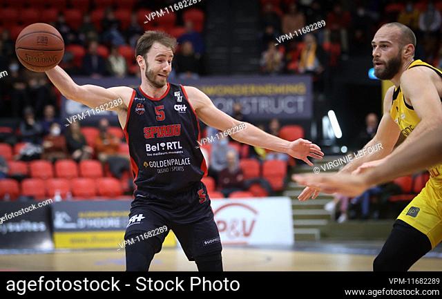 Spirou's Alex Libert and Oostende's Pierre-Antoine Gillet fight for the ball during a basketball match between BC Oostende and Spirou Charleroi