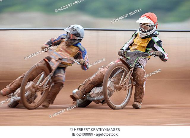 Daniel Gappmeier, #2 Austria, and Lukas Simon, #4 Austria, compete in the 2nd heat of the Austrian speedway championship on October 7, 2012 in Eggendorf