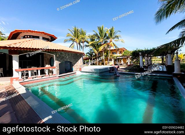 Panama Barqueta beach January 8, 2021 Panoramic view of the restaurant with swimming pool among the palm trees of the Las Olas resort at sunset