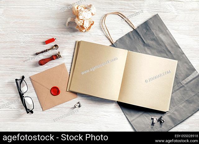 Blank stationery template on light wooden background. Mock-up for branding identity. For design presentations and portfolios. Flat lay