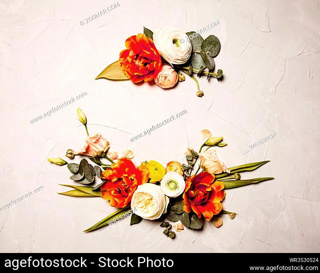 Creative orange and beige flowers flat lay border for holiday greetings