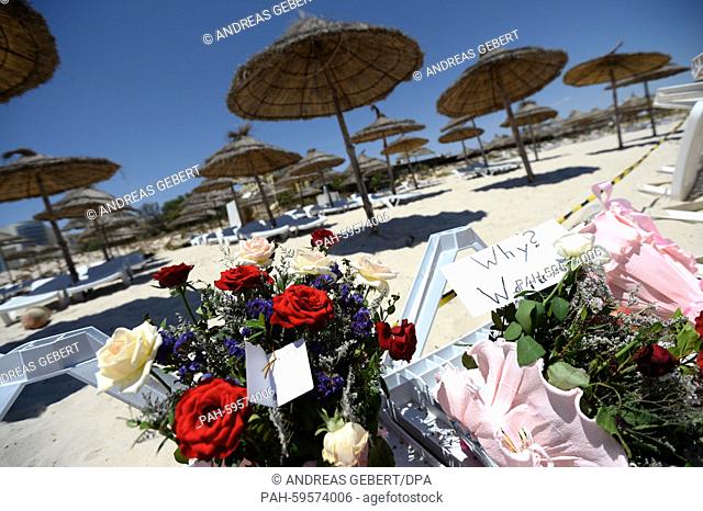 Flowers and a note which reads ""Why? Warum?"" on a sun lounger at the Imperial Marhaba Hotel in Sousse, Tunisia, 27 June 2015