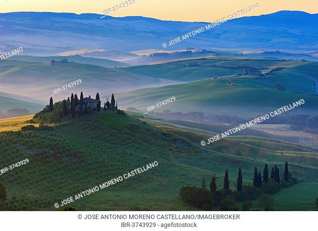 The Belvedere, morning fog, at dawn, Val d'Orcia, or Orcia Valley, UNESCO World Heritage Site, San Quirico d'Orcia, Val d'Orcia, Province of Siena, Tuscany