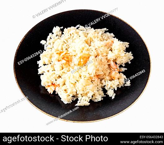 chinese cuisine - boiled jasmine rice with shrimps on dark brown plate isolated on white background