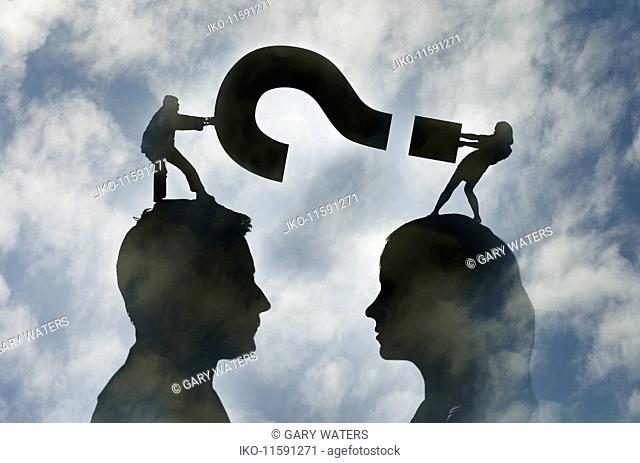 Man and woman face to face fighting over question mark