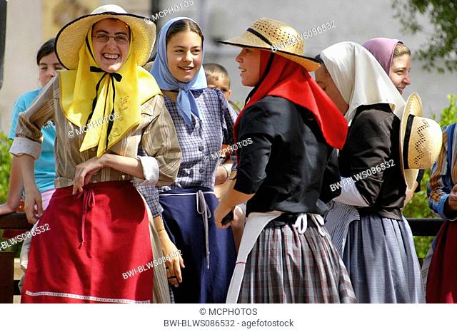 traditional dancers in menorcan dresses during a folklore festival in Ferreries, Spain, Balearen, Menorca