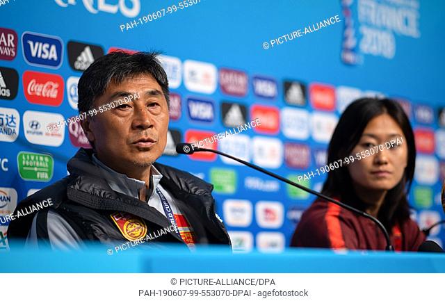 07 June 2019, France (France), Rennes: Football, women, World Cup, national team, China, press conference: Xiuquan Jia, coach of the Chinese women's national...