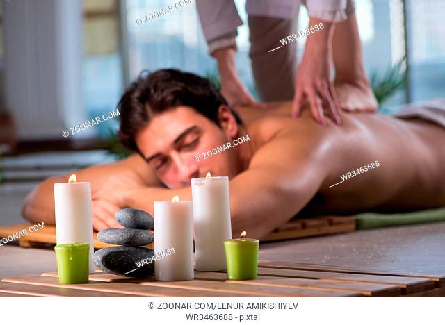 Young handsome man during spa procedure