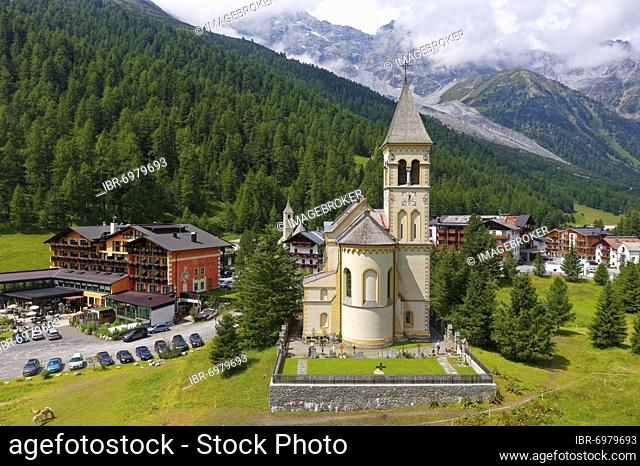 Aerial view, St. Gertaud's parish church, Parc hotel on the left, Ortler massif in the background, Sulden mountain village, Solda