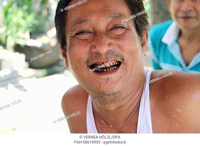 Win Zaw shows his teeth that have been stained by betel nuts in Rangoon, Myanmar, 04 May 2015. Chewing of betel nuts has spread across the impoverished country...
