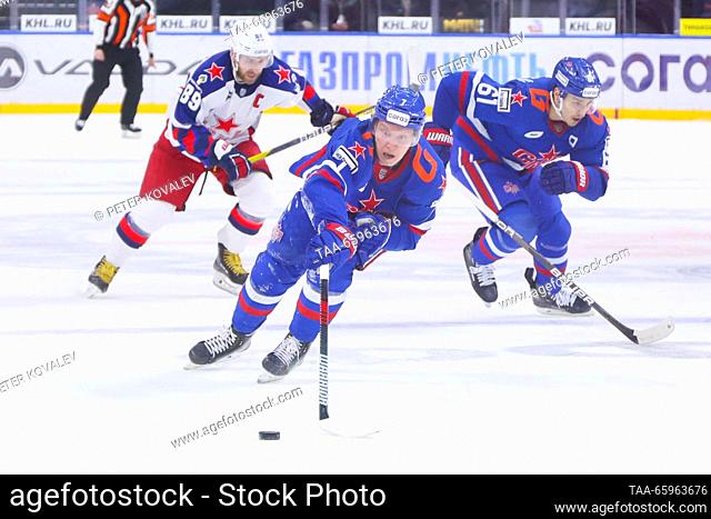 RUSSIA, ST PETERSBURG - DECEMBER 21, 2023: CSKA's Nikita Nesterov, SKA's Vasily Glotov and Marat Khayrullin (L-R) fight for the puck in a 2023/24 KHL Regular...